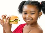 African American Girl Holding Hamburger