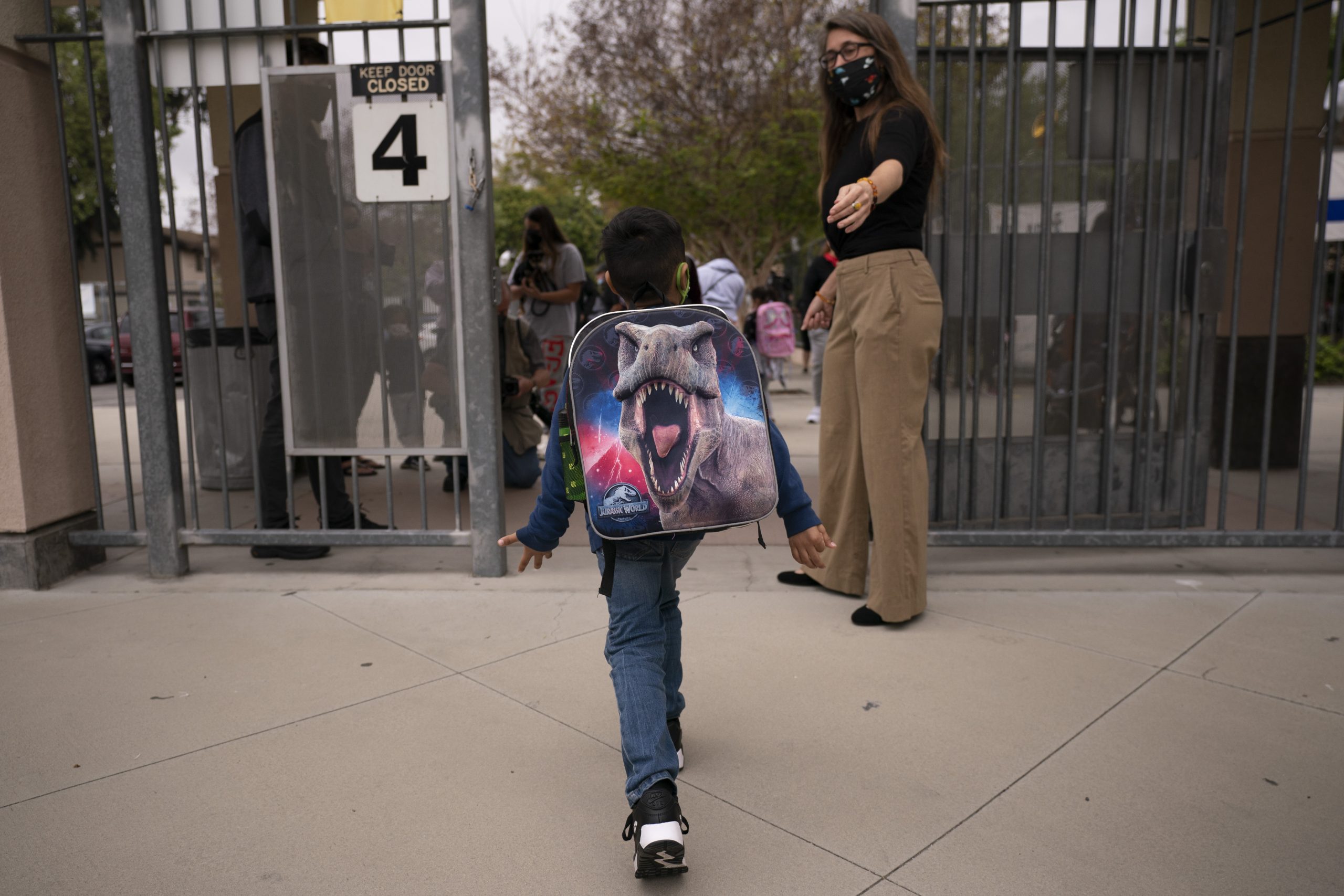 Kindergartener leaves after the first day of in-person learning at a School in Los Angeles, Tuesday, April 13, 2021. (AP Photo/Jae C. Hong)