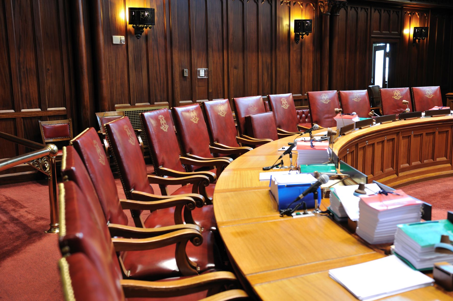 empty chairs in Connecticut Senate House Chamber